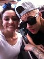 Fan taking a picture with Justin Bieber