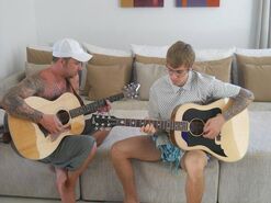 Jeremy and Justin playing guitar