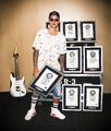 Justin Bieber with 8 Guinness World Records certificates (6)