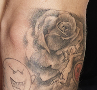 Rose tattoo right arm