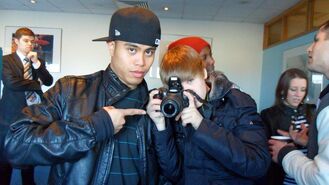 Bieber holding a camera