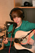 Justin Bieber playing a song on 106.1 KISS FM