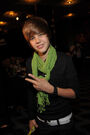 Justin Bieber wearing a green scarf