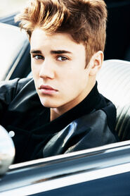Justin sitting in a car Believe photoshoot