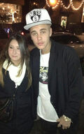 Justin Bieber with fan Dec 2013