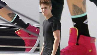 14March2012-Justin-Bieber-Praying-Hands-Tattoo