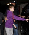 Justin Bieber opening a car door