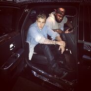 Justin Bieber sitting in a car with Blake Kelly