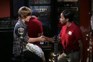 Justin shaking True Jackson's hand