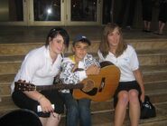 Justin Bieber on steps at Avon Theatre 2007 with people