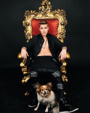 Justin Bieber sitting on a throne