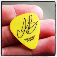 Robert holding a signed Justin Bieber plectrum