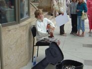 Justin Bieber sitting on a chair at Avon Theatre