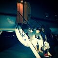 Justin Bieber & Khalil sitting on jet stairs