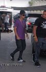 Justin Bieber wears purple shirt at airport Bangkok