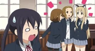 Azusa is shocked that nobody else finds cat ears weird.