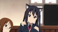 Azusa doing a cat pose.