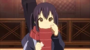 Azusa eating Yui's white day present.