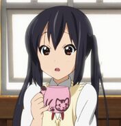 Azusa with her teacup.