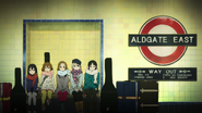 Yui and the others inside of the Aldgate East station.