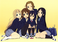 Azusa getting embraced by her friends.