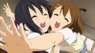 Yui hugs Azusa.