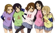 Azusa wearing a green shirt with the kanji 高 on it.