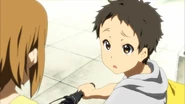 Satoshi bike.png (1.54 MB) Satoshi bringing Ritsu her student handbook.
