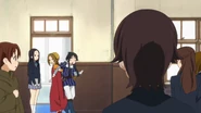 Chika watching Ritsu dragging Mio to the auditorium.