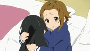Ritsu comforts Mio.png (891 KB) Ritsu comforts Mio after Sawako scares her.