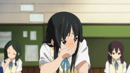 Mio holding back her laughter
