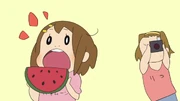 Ritsu takes pictures of Yui.