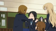 Mio's face gets fixed.png (1.33 MB) Yōko watching Ritsu fixing Mio's face with an enraptured look, unlike Fumie Kimura next to her.