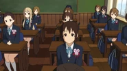 Shizuka graduating alongside her class.