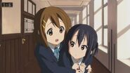 Yui hugs Azusa.