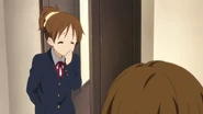 Ui giggles at Yui.