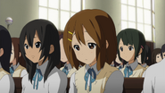 Kimiko and Yui.png (1.55 MB) Kimiko standing next to a tired Yui Hirasawa at the start of the second term.