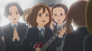 Yui performing inside of the crowd.