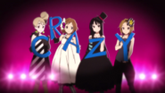 Ritsu holding the letter "Y"