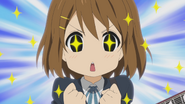 Yui's energy burst after eating Mugi's cake.