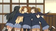 Ritsu and the others hugging Ui and Jun