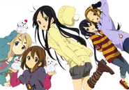 Yui holding two snowmen which resemble Nodoka and Ui.