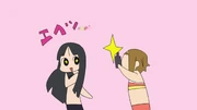 Ritsu takes pictures of Mio.