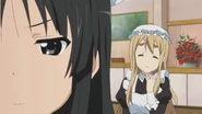 Mio isn't enjoying maid work.