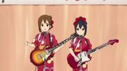 Azusa and Yui playing for the elderly.