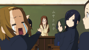 Ritsu got scolded by Sawako for talking in class.