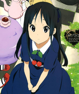 Mio wearing a blue dress.