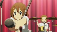 Yui lets the crowd yell into her mic.