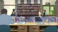 Sawako Yamanaka with her students inside of the teacher faculty office.