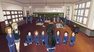 Ushio scolds Mio alongside the rest of the class.